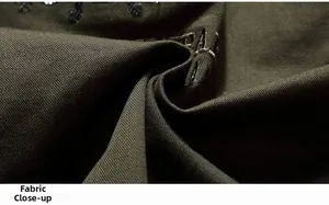 Detailed macro view of olive green twill cotton fabric with durable high-density texture