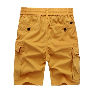 Men's bright yellow cargo shorts with multiple pockets and elastic waist on white background