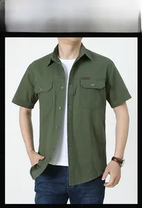 Detail view of military army green cotton shirt with buttoned pockets and outdoor label