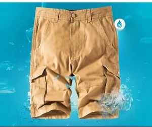 Detail of khaki cargo shorts showing functional flap pockets and breathable cotton twill fabric