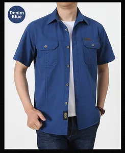 Close-up of military cargo shirt in denim blue cotton with double chest flap pockets