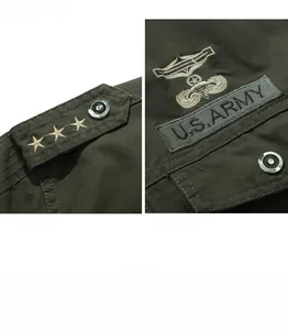 Detail of military green cotton jacket with U.S. ARMY embroidery and metal buttons