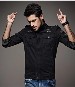 Detail of military style jacket with embroidery patches and durable zipper closure