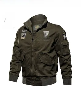 Detail view of military green cotton jacket with eagle patches and ribbed cuffs