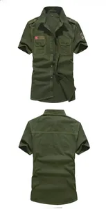 Detailed macro view of army green cotton shirt with military patches and epaulettes