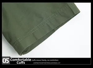 Detail of olive green cotton sleeve cuff with durable double stitching on military shirt