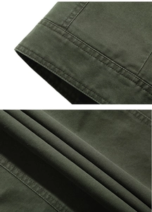 Detailed close-up of heavy-duty army green cotton twill fabric with reinforced double stitching