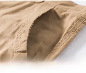 Detailed close-up of side pocket on khaki cargo shorts featuring durable double stitching