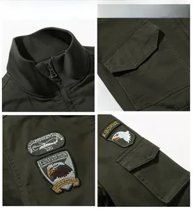 Detail view of military green bomber jacket with embroidered aviation badges and pockets
