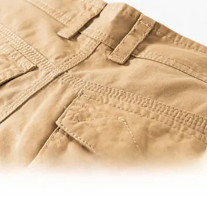Detail of reinforced belt loops and double-needle stitching on khaki cotton cargo shorts