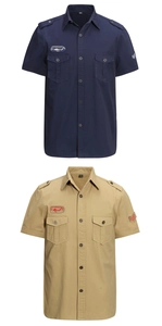 Close-up of military-style short sleeve shirt showing epaulets and embroidered badges