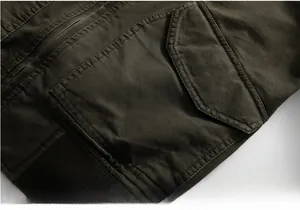 Detailed close-up of military green jacket showing reinforced stitching on side flap pocket