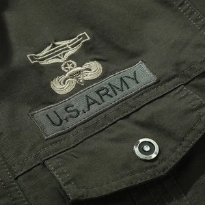 Army green military jacket featuring detailed U.S. Army embroidery and metal buttons