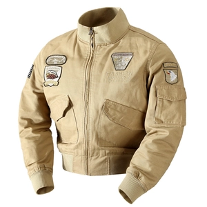 Men's khaki bomber jacket featuring military-style tactical patches and ribbed cuffs