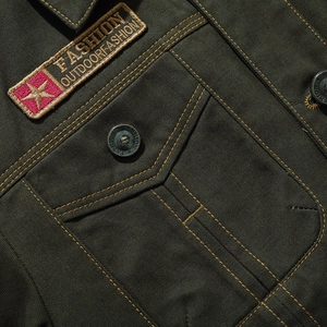 Men's olive green cotton military jacket with orange stitching and tactical patches