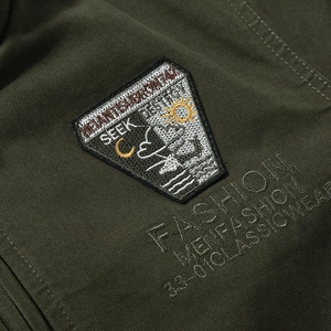 Olive green military tactical jacket featuring SEEK fashion patches and twill texture