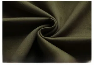 Close-up of deep olive green cotton jacket fabric with a distinct twill weave texture