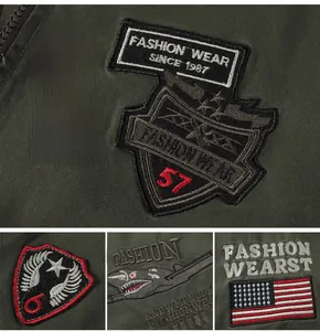 Detailed close-up of military patches and high-quality embroidery on olive green flight jacket