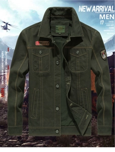 Detail of dark green cotton military jacket featuring embroidered patches and utility pockets
