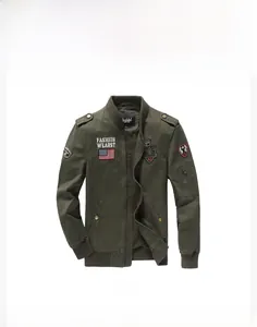 Detail of army green flight jacket showing ribbed cuffs and embroidered patches on cotton fabric