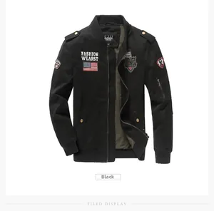Detail of black military bomber jacket with embroidered patches and high-quality metal zipper