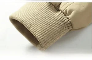Close-up of khaki flight jacket ribbed cuffs with high-quality elastic stitching detail