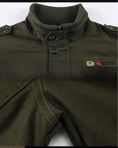 Detail of army green cargo jacket with stand-up collar and embroidered star patch
