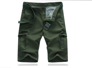 Detailed close-up of green cargo shorts showing stitching, fabric texture, and woven belt