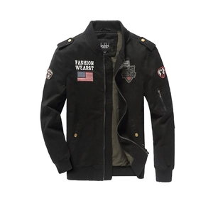 Black military flight jacket with embroidered patches and green lining on white background