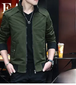 Detail view of military green slim-fit jacket with stand collar and ribbed shoulder stitching