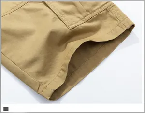 Close-up of khaki cargo shorts showing heavy-duty stitching and cotton twill fabric