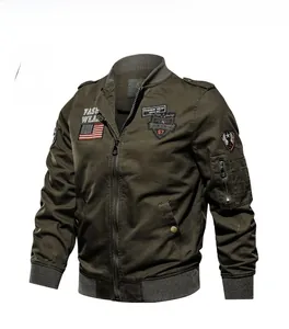 Detail of military green flight jacket featuring classic patches and grey ribbed trim