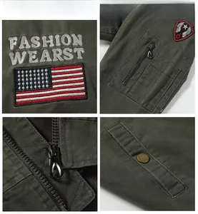 Detail of army green cotton jacket with military patches and sleeve zipper pocket