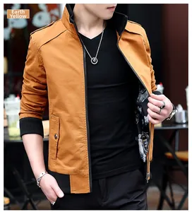 Detail of earthy yellow casual jacket featuring metal zipper and black ribbed cuffs