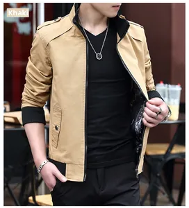 Detail view of khaki cotton jacket with ribbed cuffs and shoulder button tabs