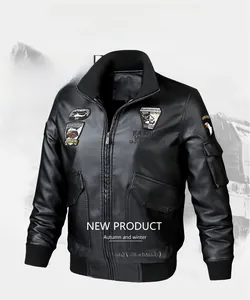 Close-up of black PU leather bomber jacket with detailed aviation embroidery patches