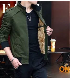 Close-up of dark green men's jacket with warm brown faux lamb wool lining and zipper