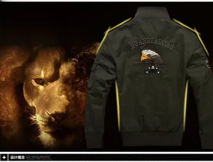 Detail of dark green bomber jacket featuring eagle and helicopter embroidery on the back