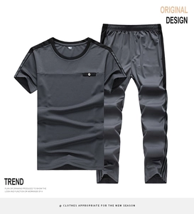 Detail of grey men's sports set showing breathable mesh fabric and zipped chest pocket