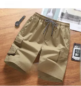Flat lay of khaki cargo shorts with elastic drawstring waist and side flap pockets