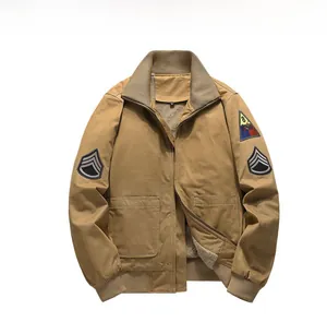 Detail of khaki military bomber jacket with fleece lining and army badges