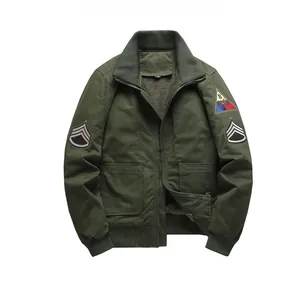 Detail of army green bomber jacket featuring military badges and warm fleece lining