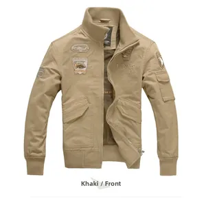 Detail of khaki military jacket with embroidered aviation patches and ribbed cuffs