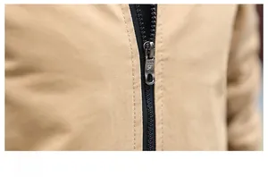 Macro detail of high-quality metal zipper and twill fabric on khaki casual jacket