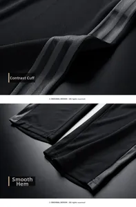 Macro detail of breathable mesh fabric on black sports pants with gray side stripes and flat hem