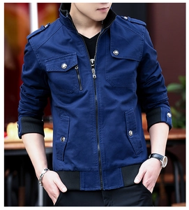 Detail of navy blue utility jacket featuring stand collar, epaulettes and cargo pockets