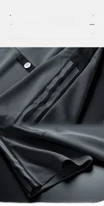 Detail of gray breathable honeycomb mesh fabric and striped cuff on men's sport polo