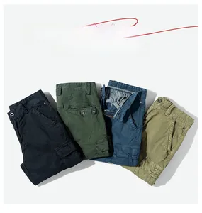 Detail of multi-pocket cargo shorts in solid colors with premium cotton twill texture