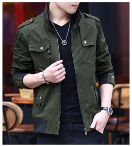Detailed view of military dark green jacket with stand collar and epaulettes