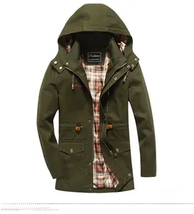 Detail of olive green parka jacket with contrast plaid lining and adjustable hood